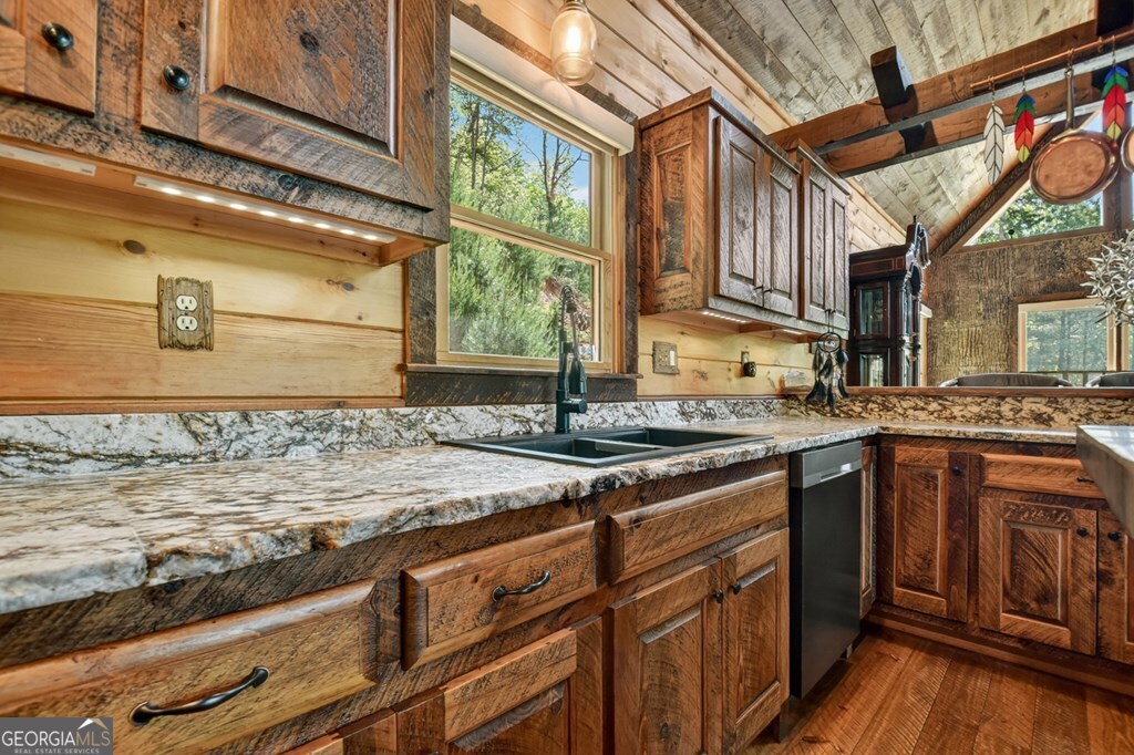 459 Quail Ridge Road Epworth, GA 30541 - Photo 47 of 73 a kitchen with stainless steel appliances granite countertop a sink stove and cabinets