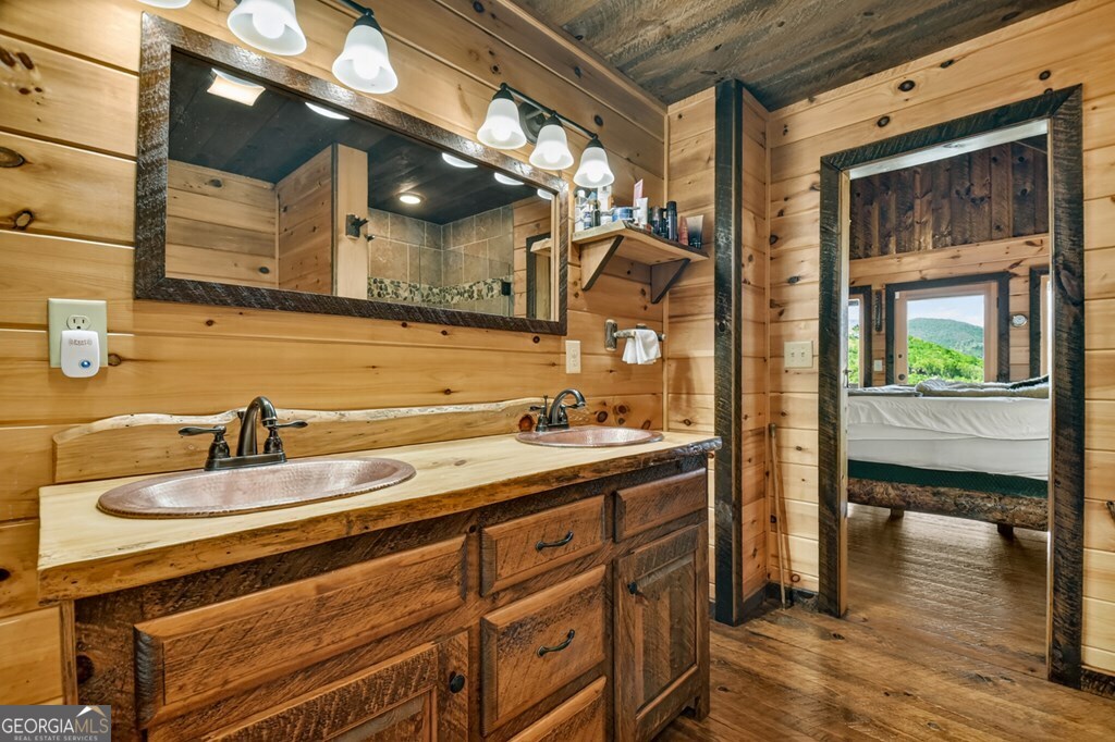 459 Quail Ridge Road Epworth, GA 30541 - Photo 58 of 73 a bathroom with a sink and a mirror