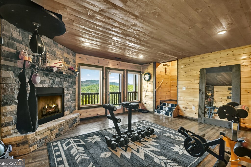 459 Quail Ridge Road Epworth, GA 30541 - Photo 63 of 73 a living room with furniture fireplace and flat screen tv