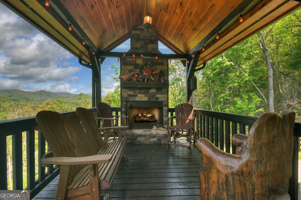 459 Quail Ridge Road Epworth, GA 30541 - Photo 7 of 73 a view of a balcony with chairs and wooden floor