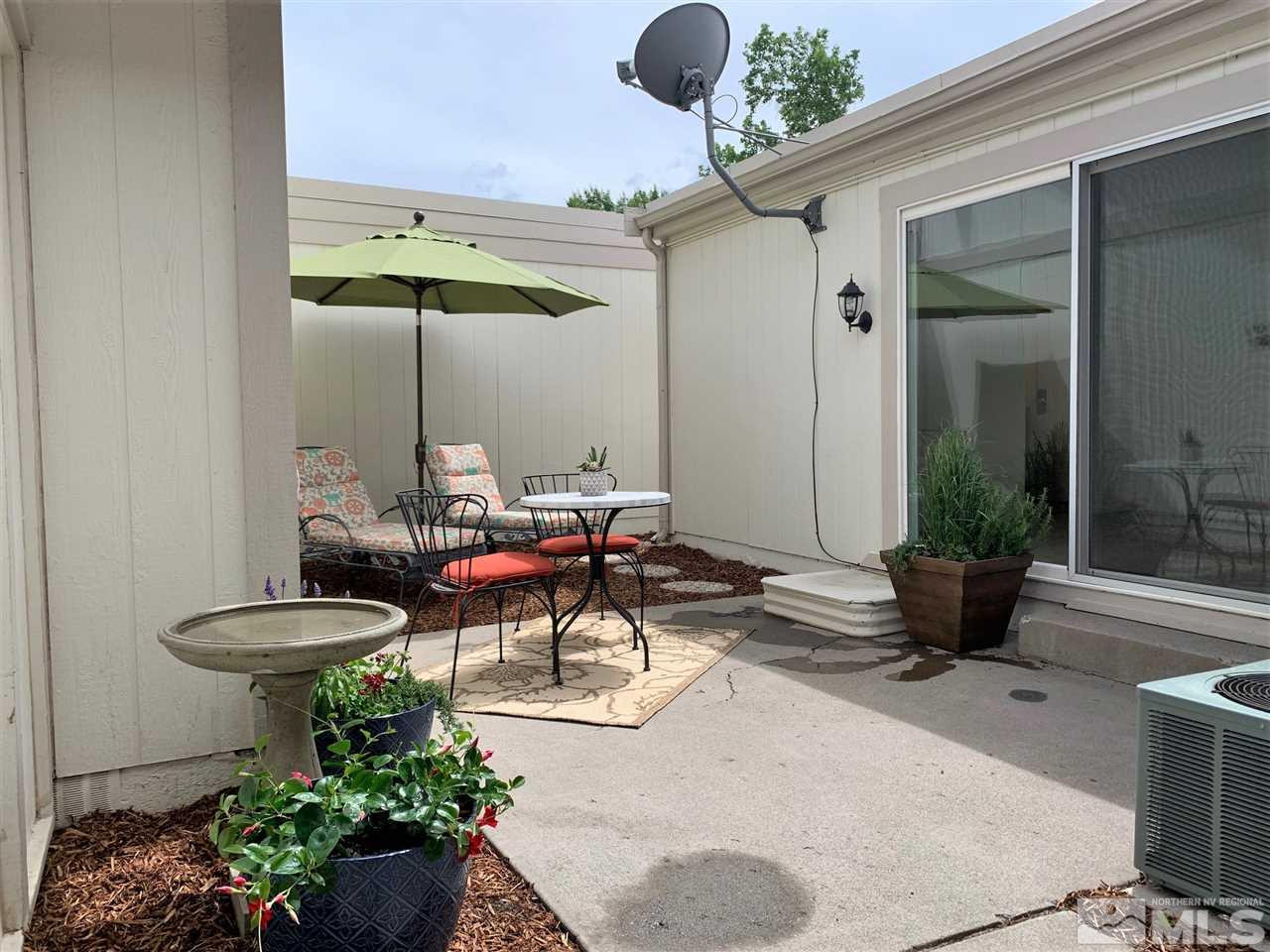 1216 Laredo Court Reno, NV 89503 - Photo 11 of 28 a view of a lounge chair in the patio and a fountain in the patio
