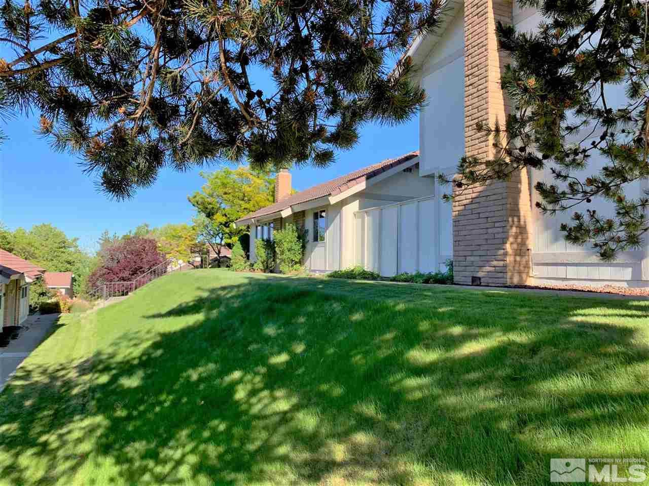 1216 Laredo Court Reno, NV 89503 - Photo 2 of 28 a view of a house with a yard