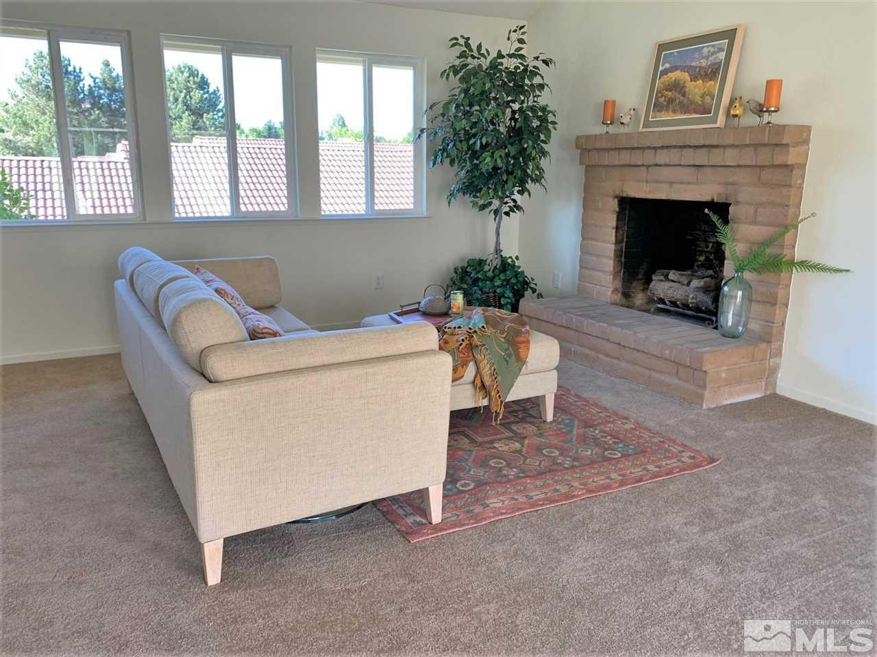 1216 Laredo Court Reno, NV 89503 - Photo 4 of 28 a living room with furniture and a fireplace