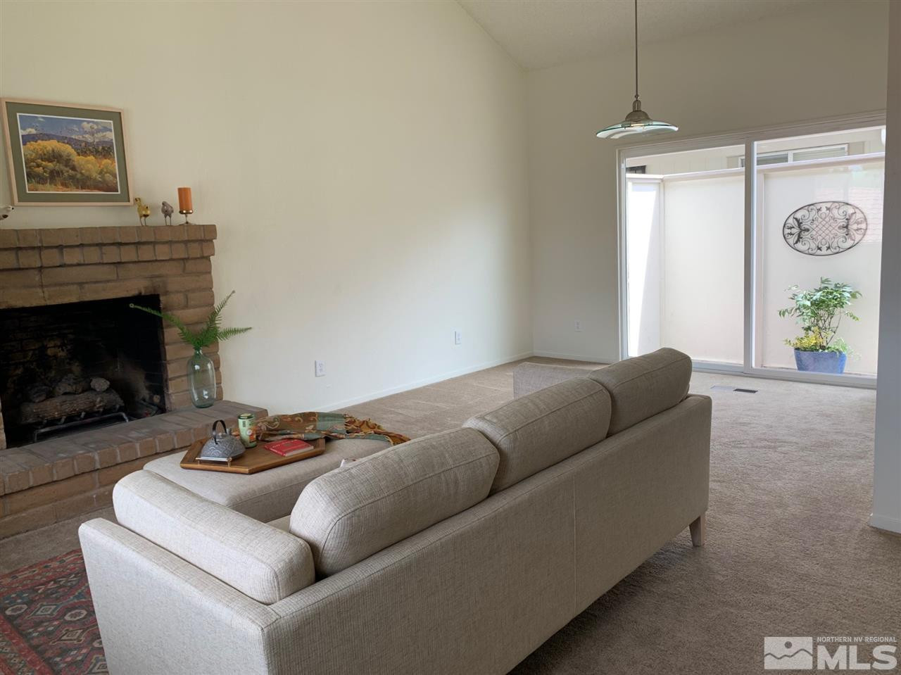 1216 Laredo Court Reno, NV 89503 - Photo 6 of 28 a living room with furniture and a fireplace