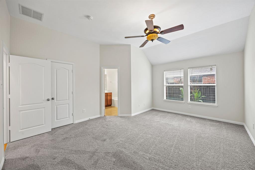 2804 Barco Grand Prairie, TX 75054 - Photo 12 of 25 a view of a livingroom with a ceiling fan and window
