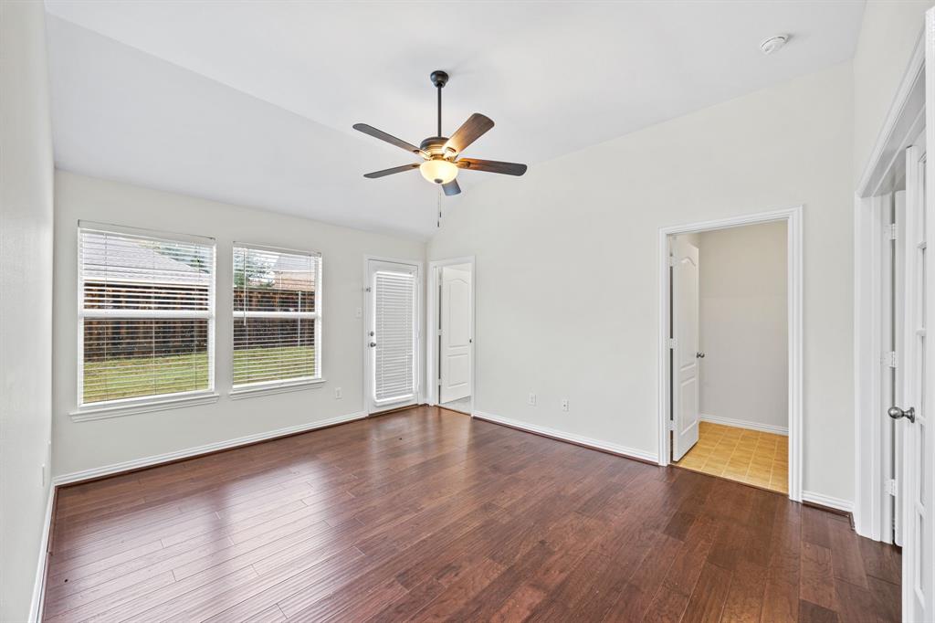 2804 Barco Grand Prairie, TX 75054 - Photo 18 of 25 a view of an empty room with a window and wooden floor