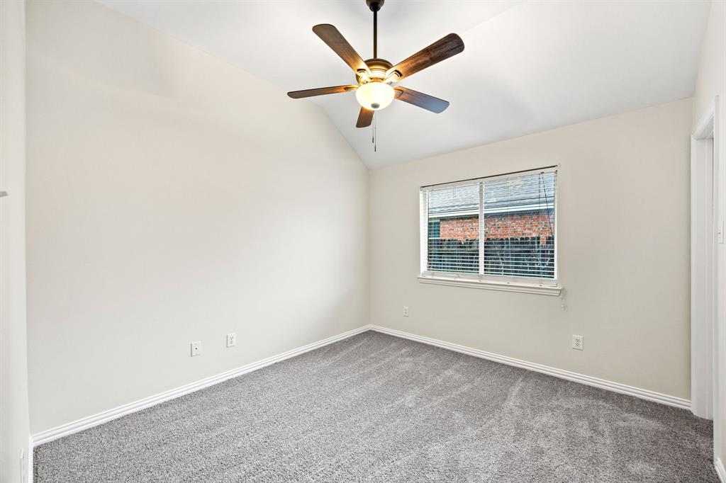 2804 Barco Grand Prairie, TX 75054 - Photo 19 of 25 an empty room with window and ceiling fan