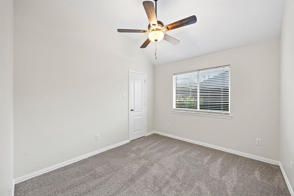 2804 Barco Grand Prairie, TX 75054 - Photo 20 of 25 an empty room with a window and a fan