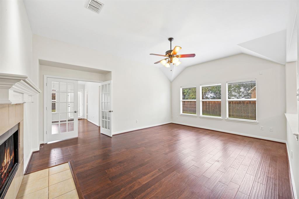 2804 Barco Grand Prairie, TX 75054 - Photo 10 of 25 a view of an empty room with wooden floor and a window