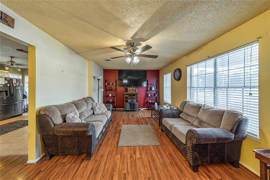 10 Carter Road Van Alstyne, TX 75495 - Photo 2 of 37 a living room with furniture and a large window