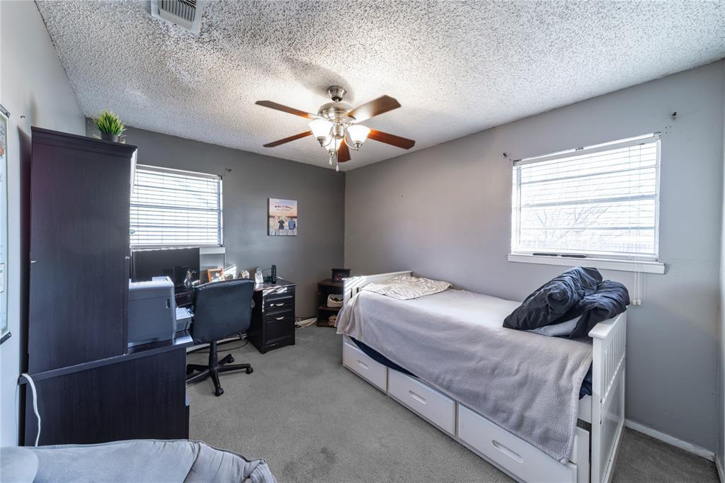 10 Carter Road Van Alstyne, TX 75495 - Photo 22 of 37 a bedroom with a bed and a window