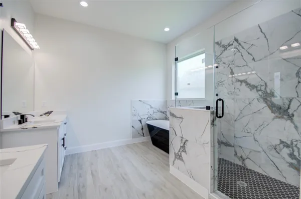 a bathroom with a sink toilet and tub