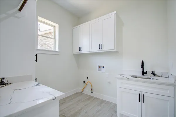 a room with a sink and a window