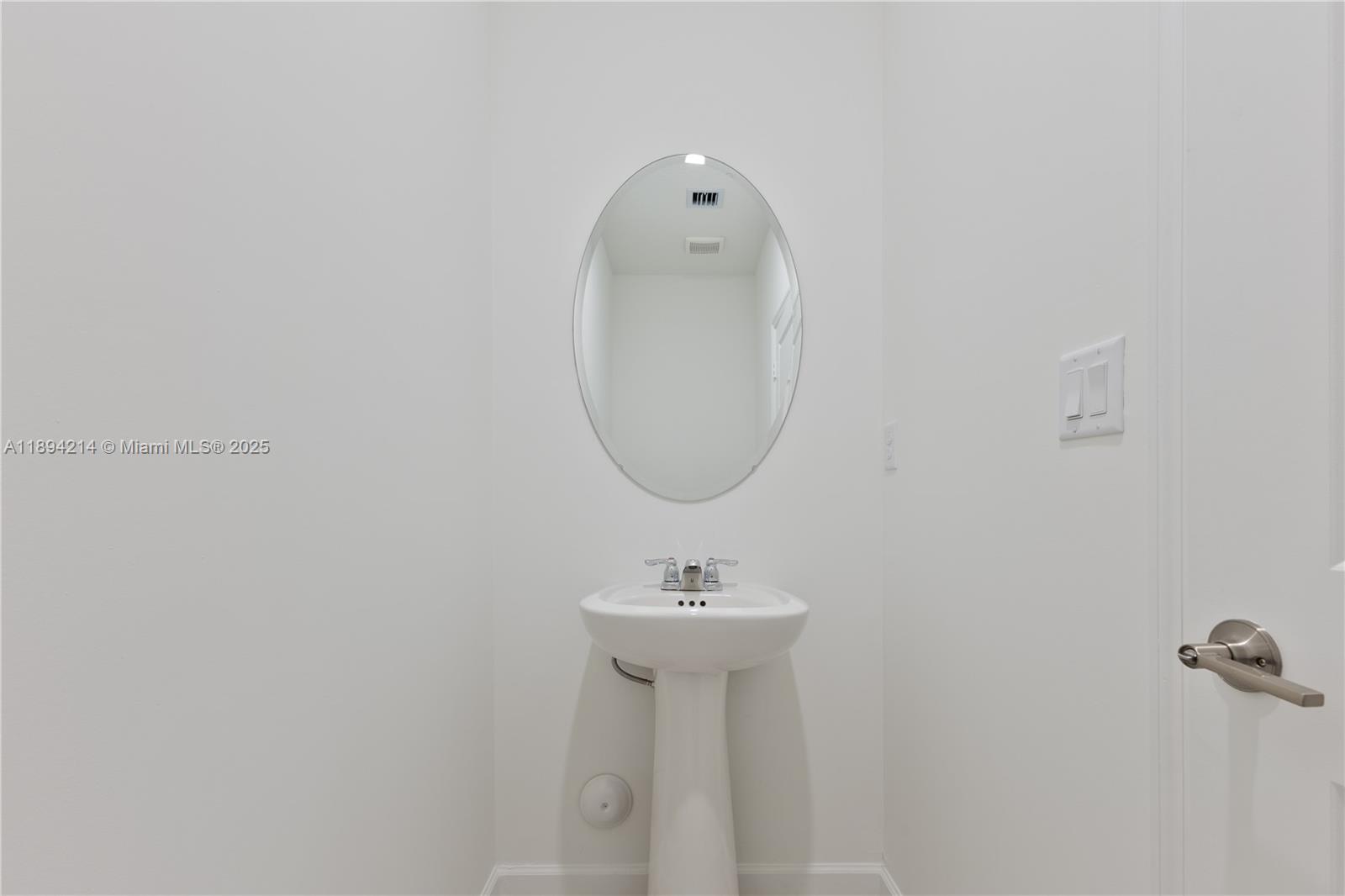 13203 Southwest 188th Terrace, Unit 13203 Miami, FL 33177 - Photo 15 of 49 a bathroom with a sink and a mirror