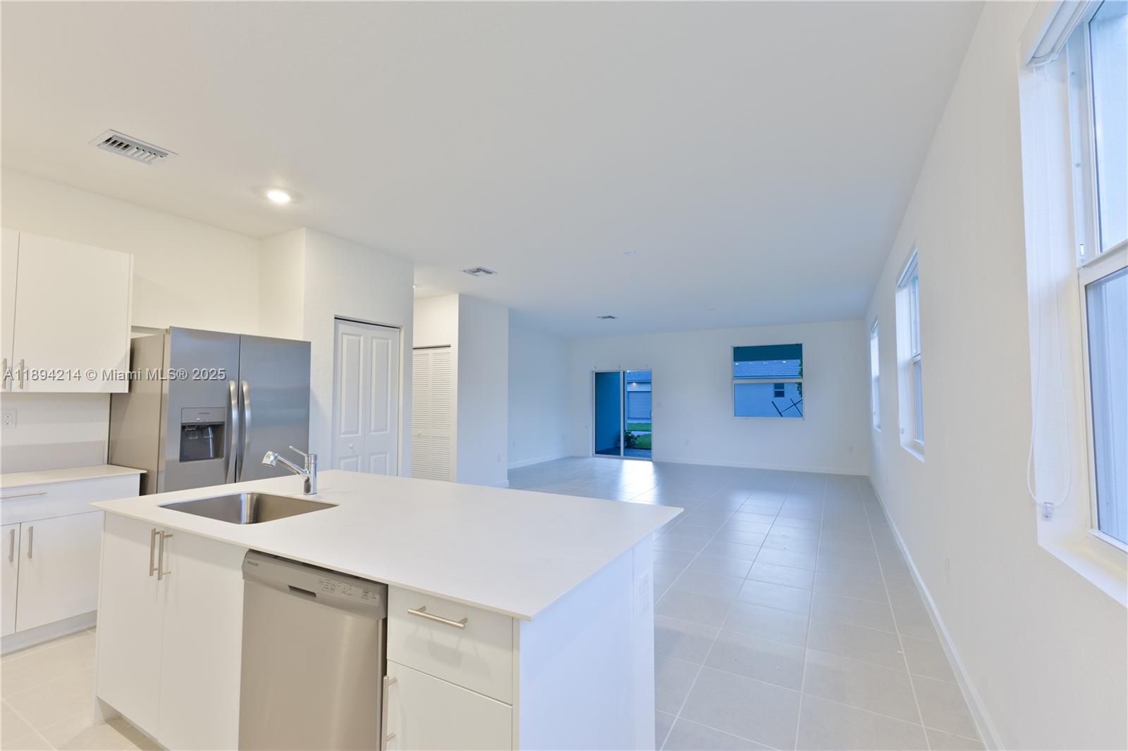 13203 Southwest 188th Terrace, Unit 13203 Miami, FL 33177 - Photo 22 of 49 a view of kitchen with sink refrigerator and microwave