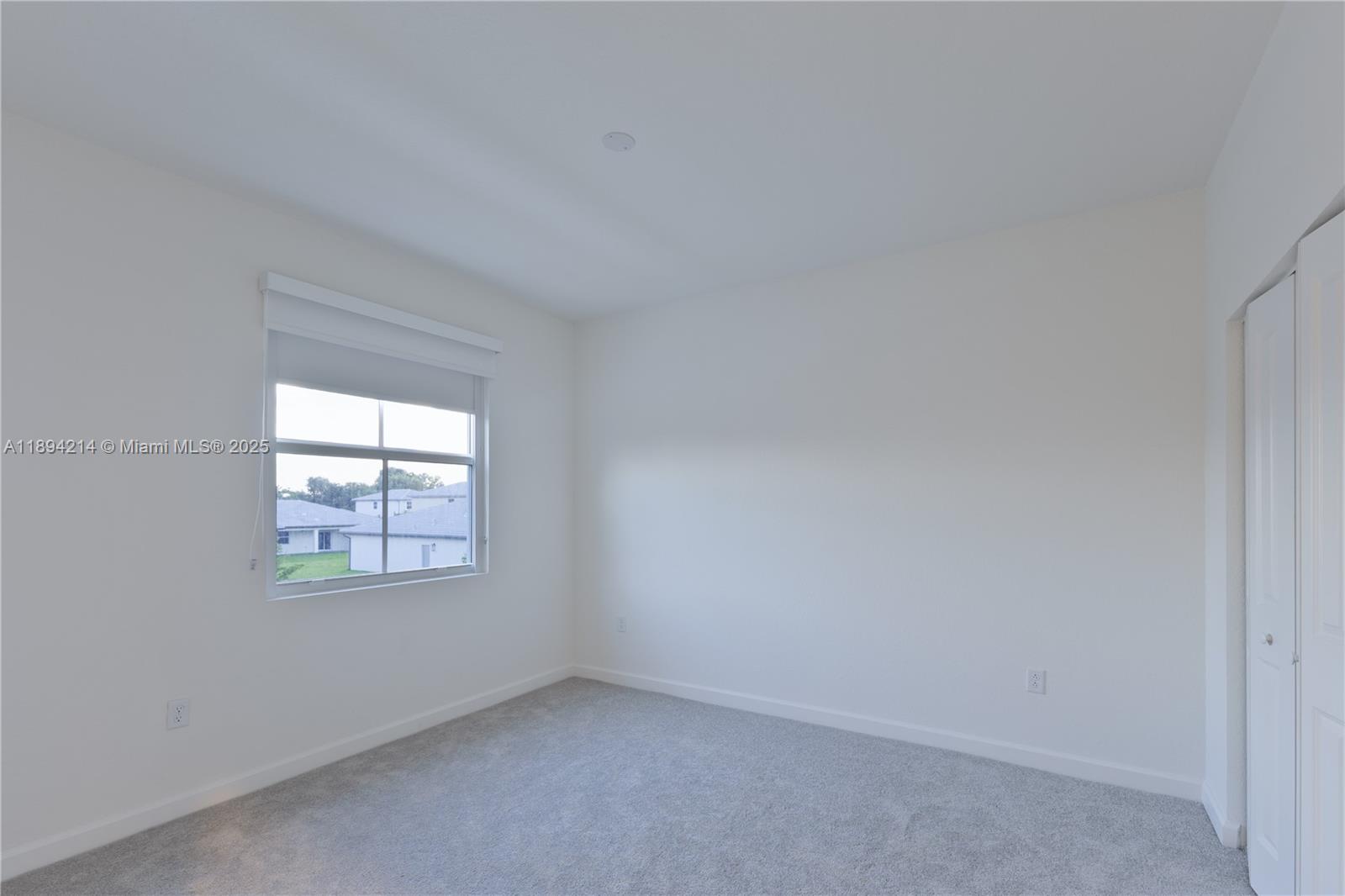 13203 Southwest 188th Terrace, Unit 13203 Miami, FL 33177 - Photo 28 of 49 an empty room with a window