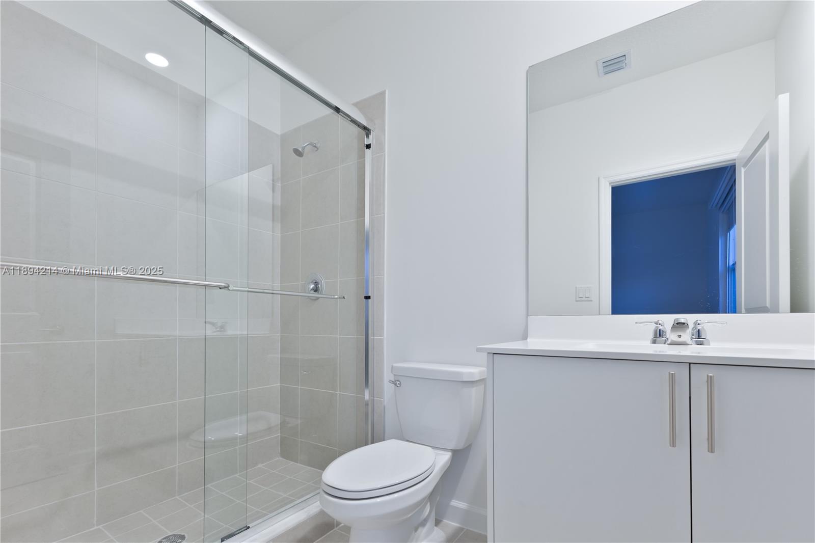 13203 Southwest 188th Terrace, Unit 13203 Miami, FL 33177 - Photo 36 of 49 a bathroom with a sink a toilet and shower