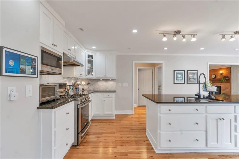 3167 Northbrook Drive Atlanta, GA 30341 - Photo 11 of 41 a kitchen with granite countertop a sink and cabinets