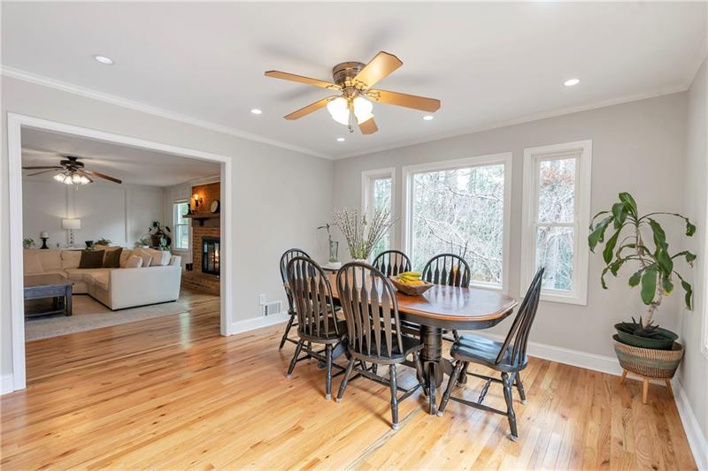 3167 Northbrook Drive Atlanta, GA 30341 - Photo 15 of 41 a dining room with furniture a chandelier and wooden floor