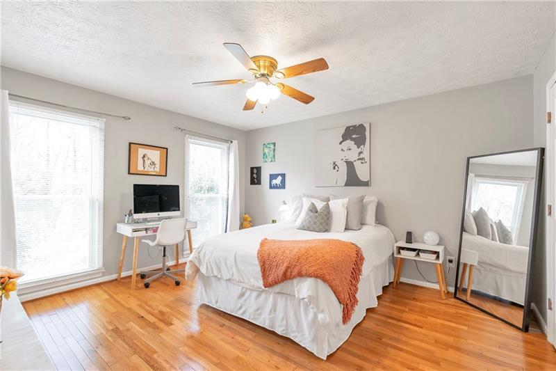 3167 Northbrook Drive Atlanta, GA 30341 - Photo 24 of 41 a bedroom with a bed and wooden floor