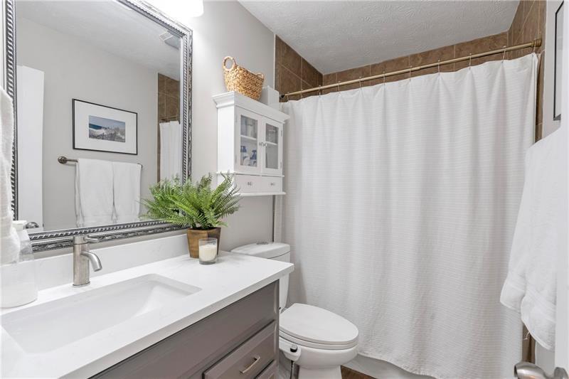 3167 Northbrook Drive Atlanta, GA 30341 - Photo 25 of 41 a bathroom with a sink a toilet and a mirror