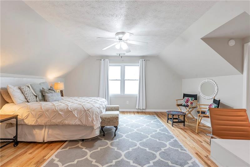 3167 Northbrook Drive Atlanta, GA 30341 - Photo 33 of 41 a bedroom with a bed and wooden floor