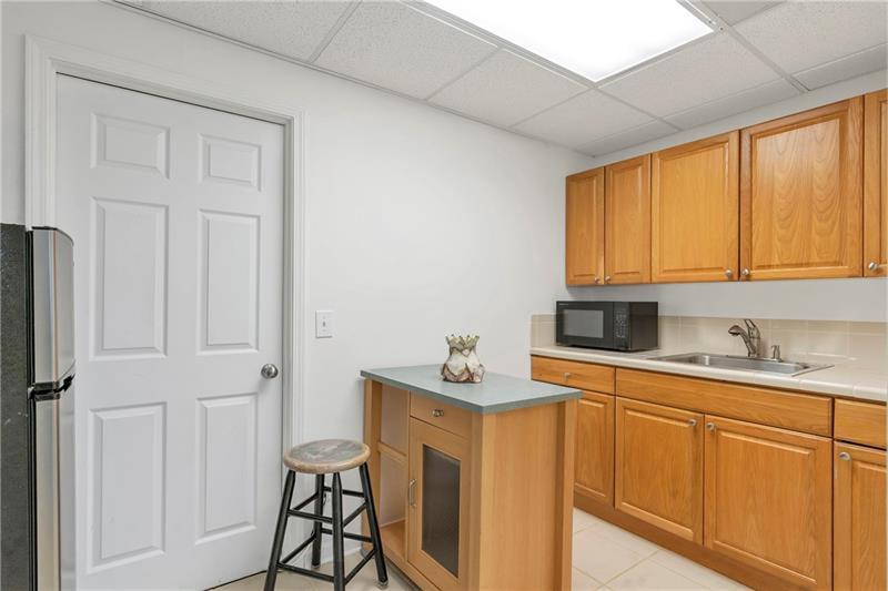 3167 Northbrook Drive Atlanta, GA 30341 - Photo 39 of 41 a kitchen with stainless steel appliances granite countertop white cabinets sink and a window