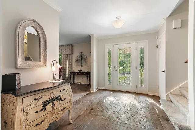 a spacious bedroom with a bed and a large window