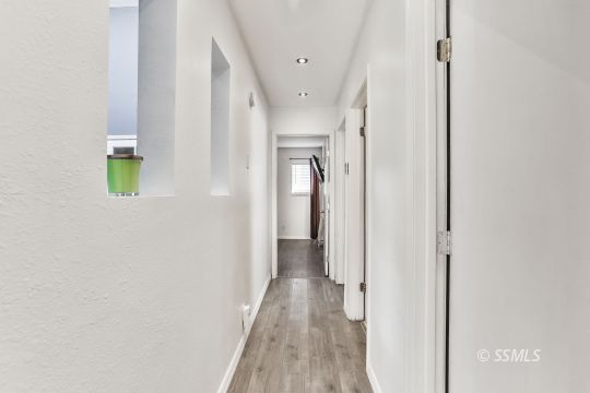 515 South Downs Street Ridgecrest, CA 93555 - Photo 17 of 31 a view of a hallway with wooden floor and closet