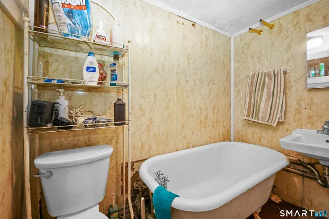 a bathroom with a toilet and a sink