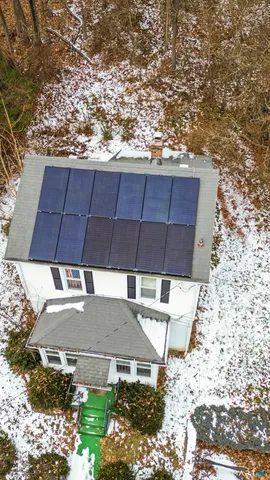 a picture of a bench in front of a wall