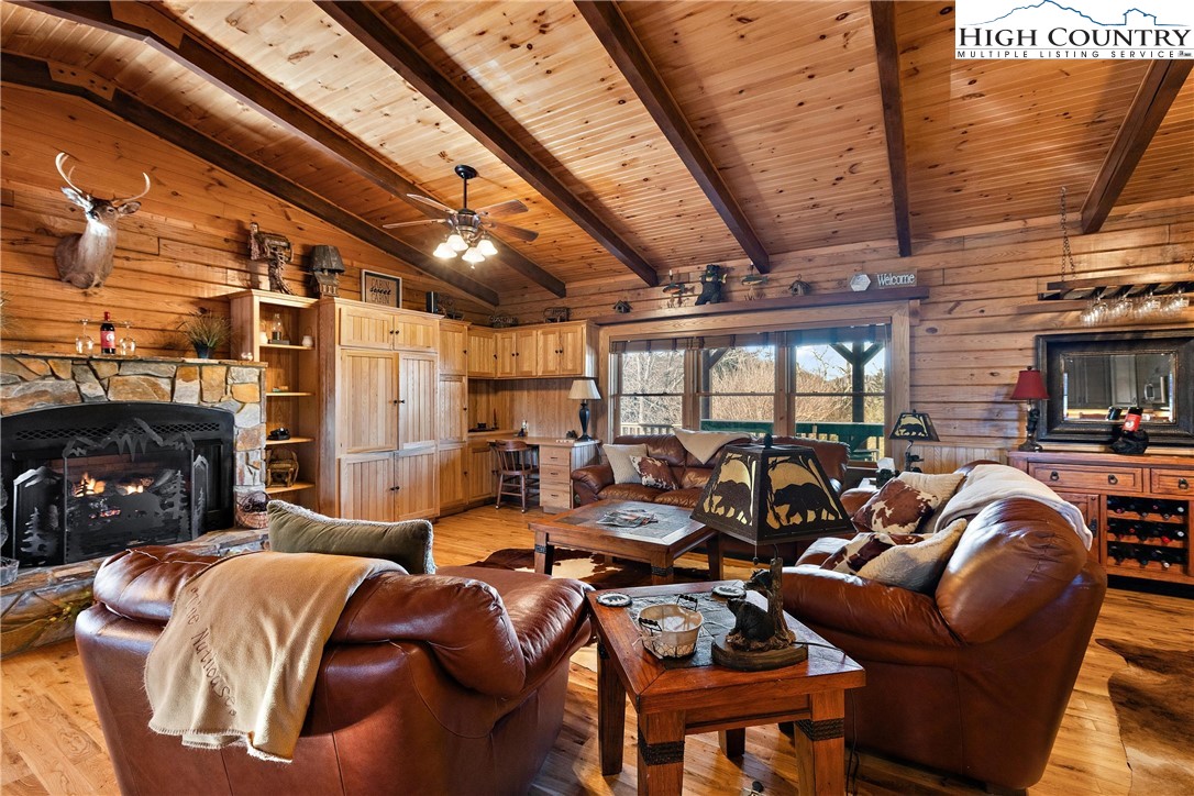 52 Hackett Gragg Road Newland, NC 28657 - Photo 11 of 41 a media room with lots of chairs and a fireplace