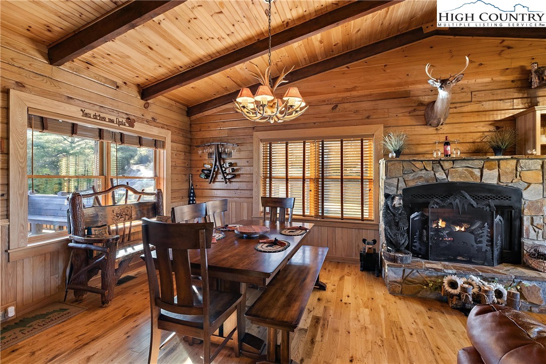 52 Hackett Gragg Road Newland, NC 28657 - Photo 12 of 41 a view of a dining room with furniture window and wooden floor
