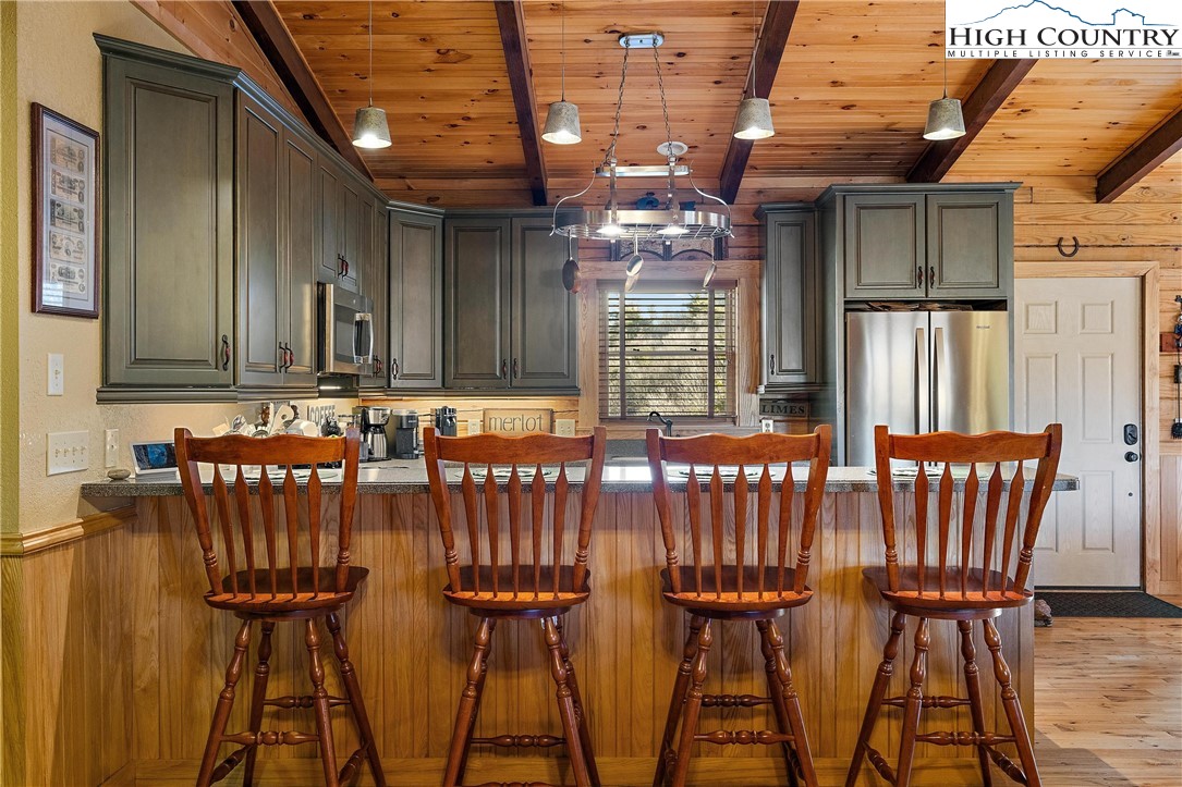 52 Hackett Gragg Road Newland, NC 28657 - Photo 17 of 41 a view of a chairs and table in the patio