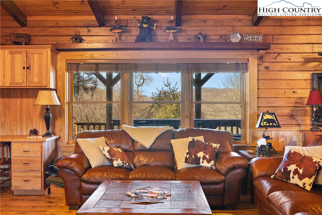 52 Hackett Gragg Road Newland, NC 28657 - Photo 22 of 41 a living room with furniture and a floor to ceiling window