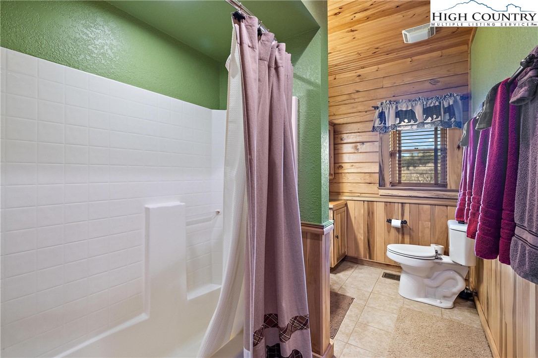 52 Hackett Gragg Road Newland, NC 28657 - Photo 27 of 41 a bathroom with a bathtub and shower