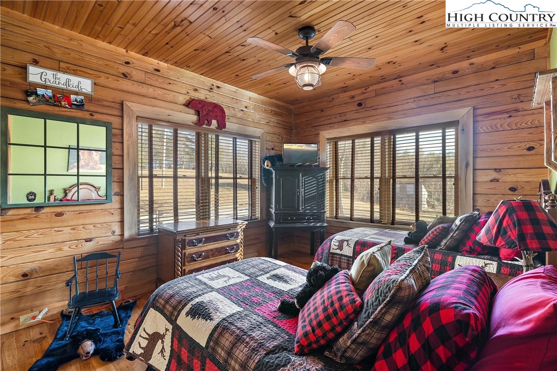 52 Hackett Gragg Road Newland, NC 28657 - Photo 30 of 41 a bedroom with a bed and a large window