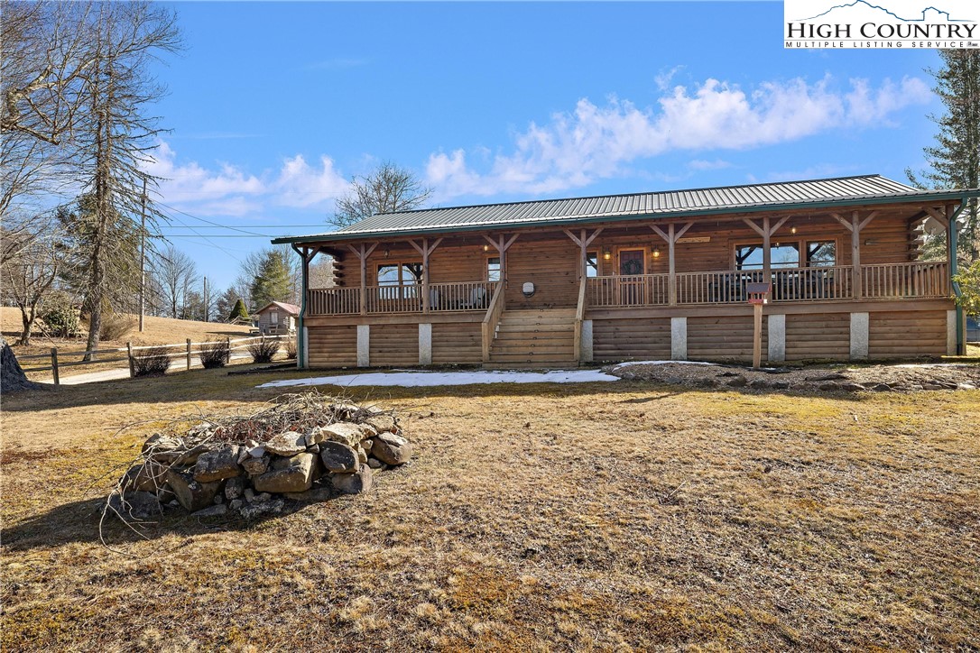 52 Hackett Gragg Road Newland, NC 28657 - Photo 3 of 41 a front view of a house with a yard