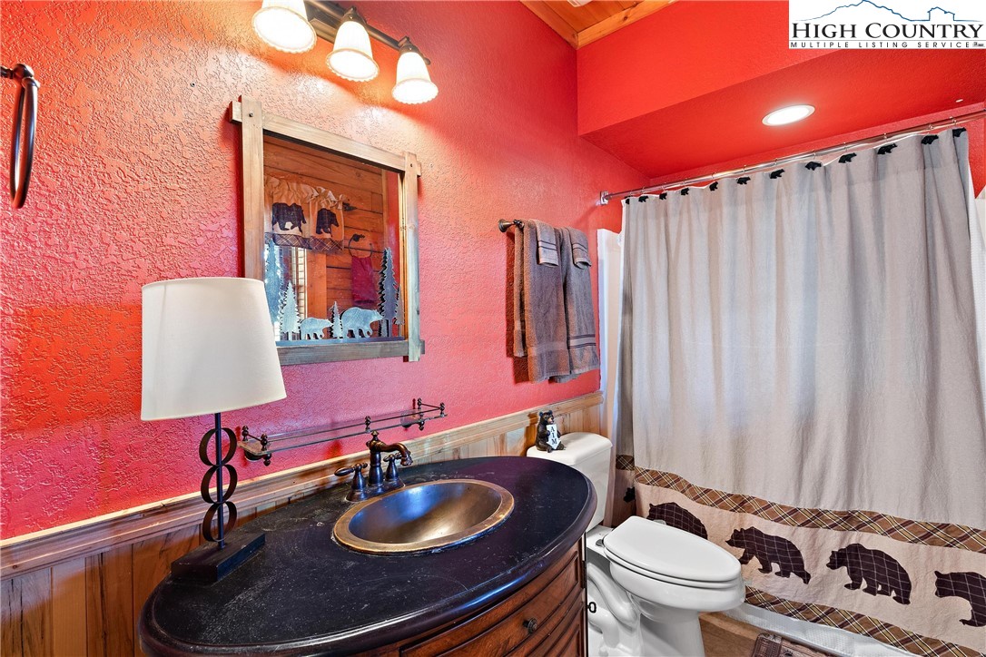 52 Hackett Gragg Road Newland, NC 28657 - Photo 36 of 41 a bathroom with a sink a toilet and a mirror