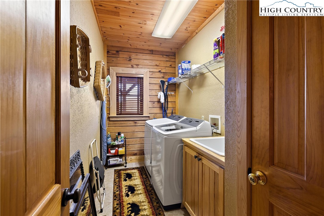 52 Hackett Gragg Road Newland, NC 28657 - Photo 37 of 41 a view of walk in closet with clothes