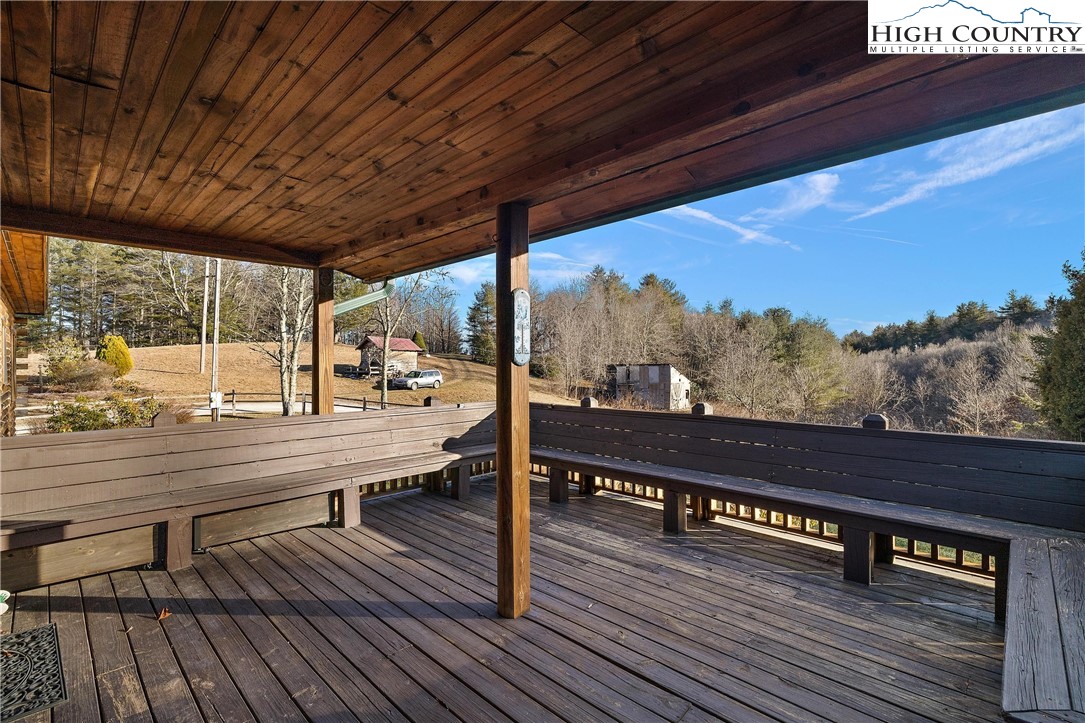 52 Hackett Gragg Road Newland, NC 28657 - Photo 38 of 41 a view of a roof deck with wooden floor and furniture
