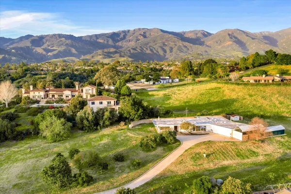 a view of a city with mountains in the background