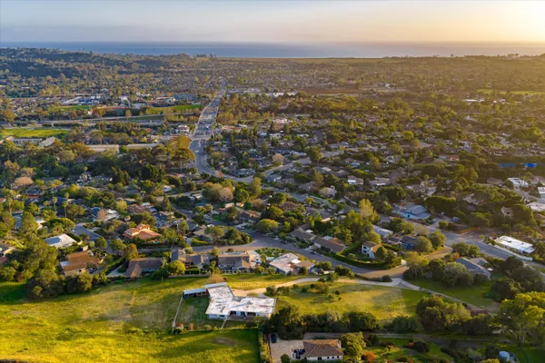 an aerial view of residential building and ocean