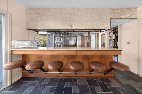 a kitchen with stainless steel appliances granite countertop a stove a sink dishwasher and a oven with cabinets