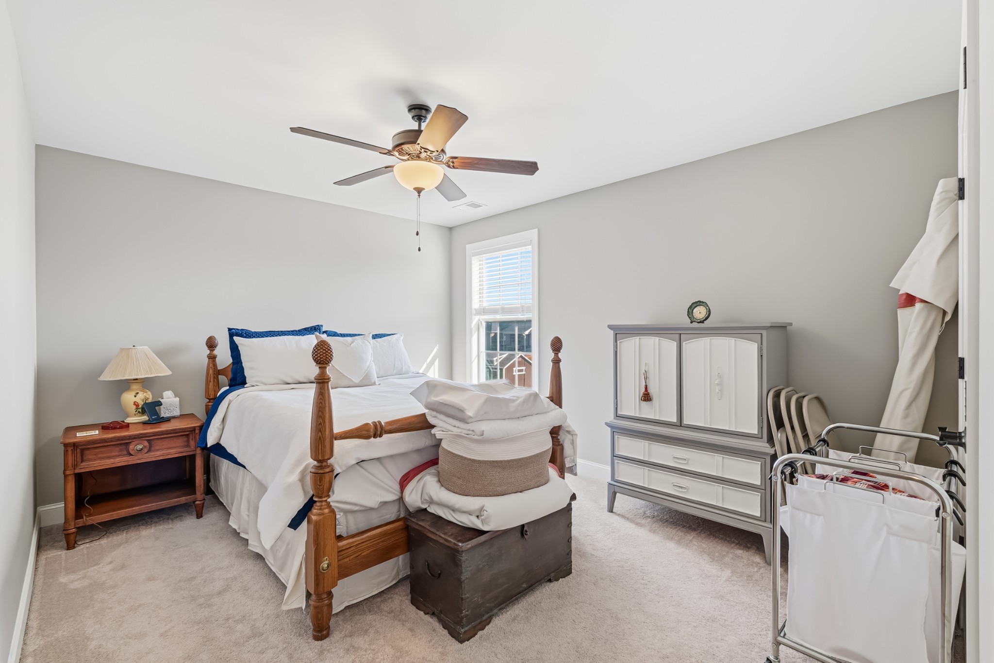 1008 Ash Ridge Road Lascassas, TN 37085 - Photo 20 of 34 a bedroom with a bed and a chandelier