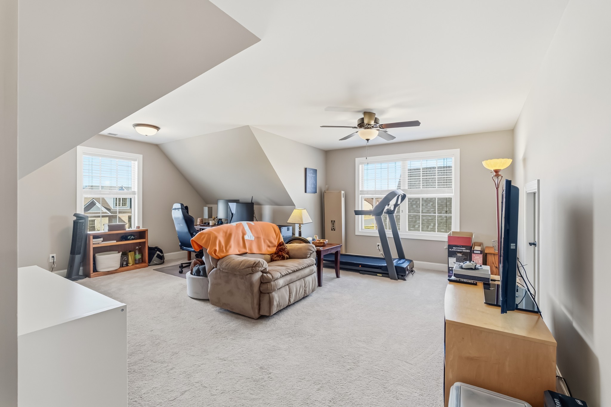 1008 Ash Ridge Road Lascassas, TN 37085 - Photo 22 of 34 a living room with furniture gym equipment and a large window