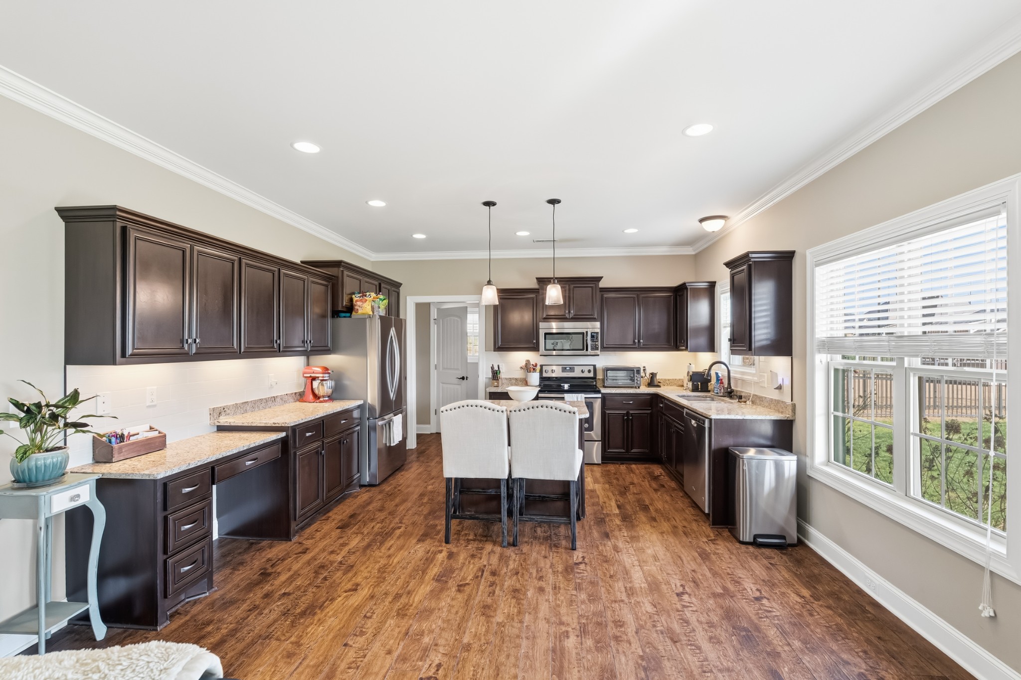 1008 Ash Ridge Road Lascassas, TN 37085 - Photo 8 of 34 a large kitchen with a table and chairs in it