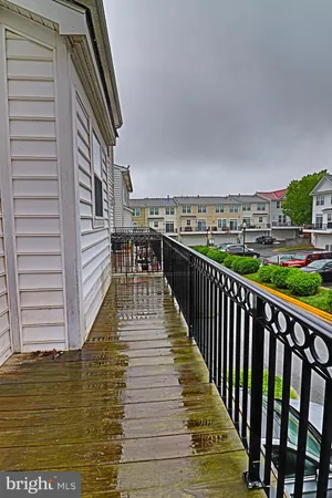 a view of balcony with wooden floor and city view