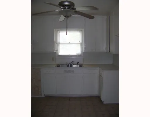 a bathroom with a sink and a window