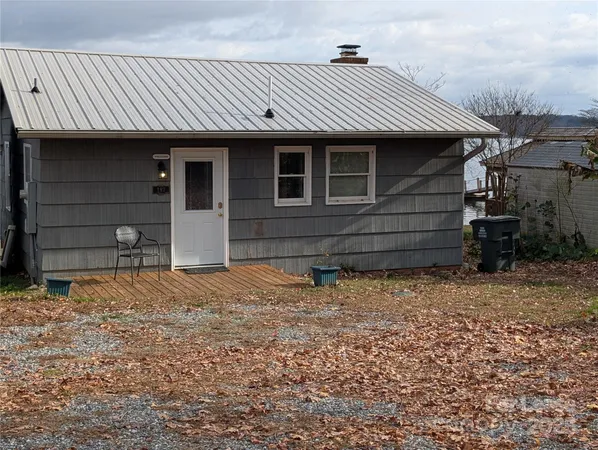 a front view of a house having a yard